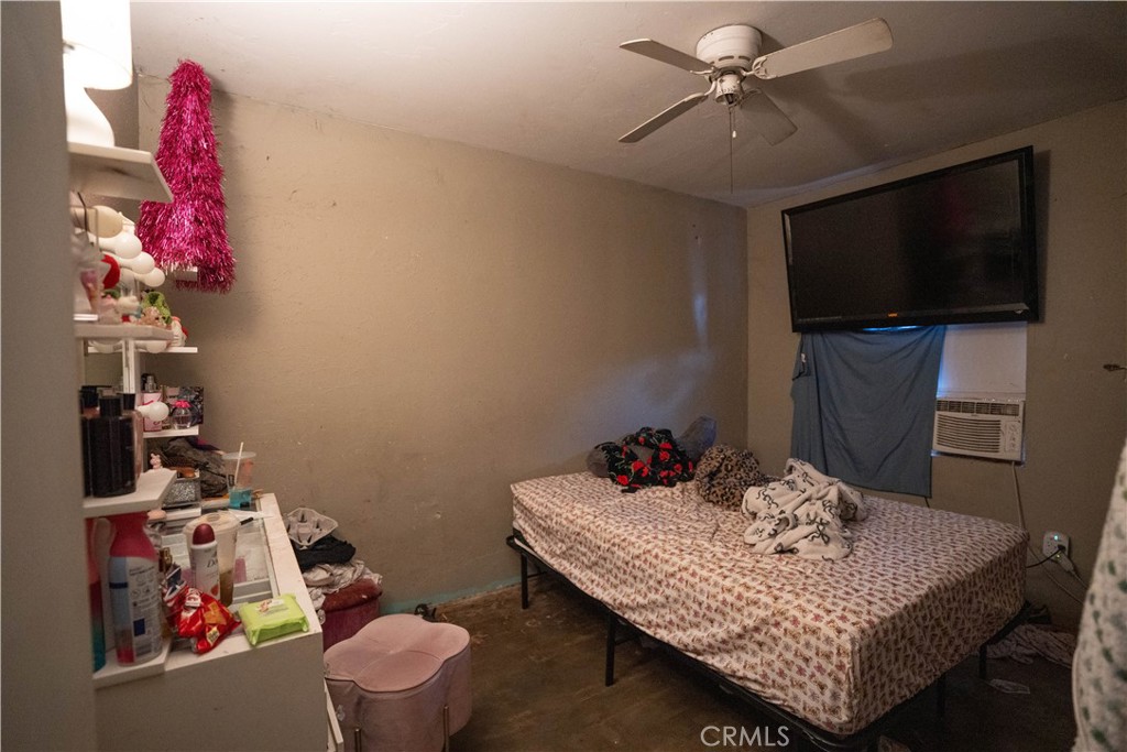 6174 Jurupa Avenue Riverside, CA 92504 - Photo 25 of 30 a living room with furniture and a flat screen tv