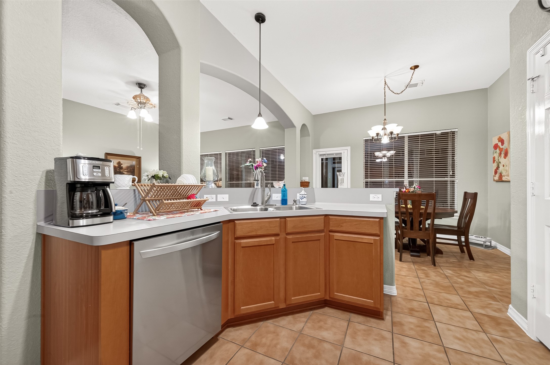 12455 West Summerlin Conroe, TX 77302 - Photo 12 of 31 a kitchen with cabinets and chairs
