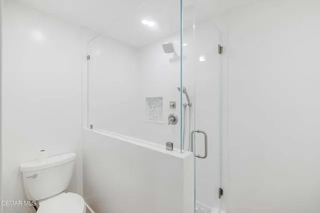 a bathroom with a sink vanity and mirror