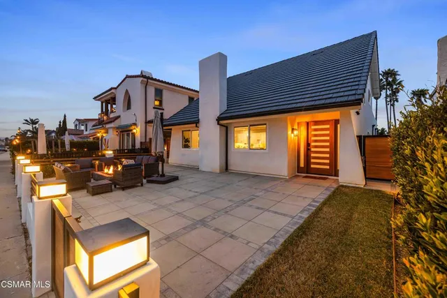 a outdoor living space with furniture and a fireplace
