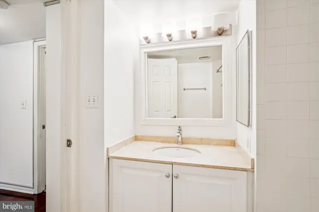 a bathroom with a bath tub with a shower