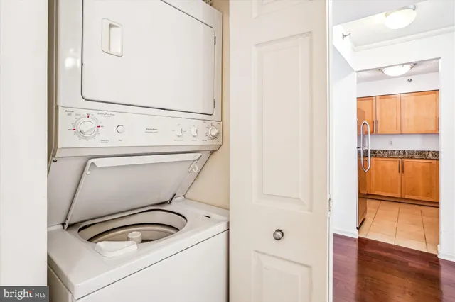 a picture of a bathroom with a window and a white wall