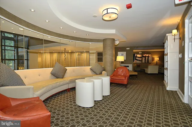 a room with lots of tables and chairs