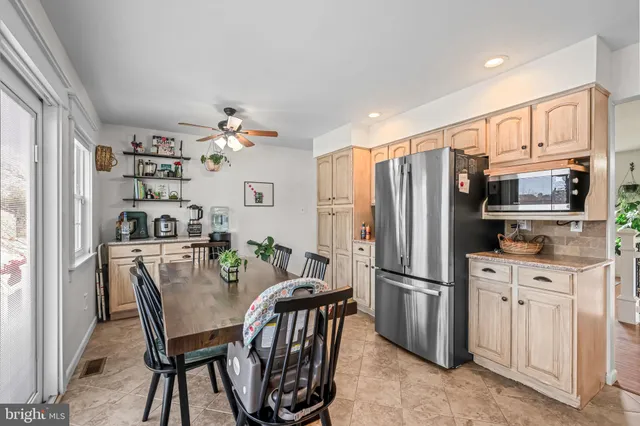 a dining room with furniture and window