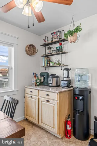 a view of a balcony with wooden floor and fence