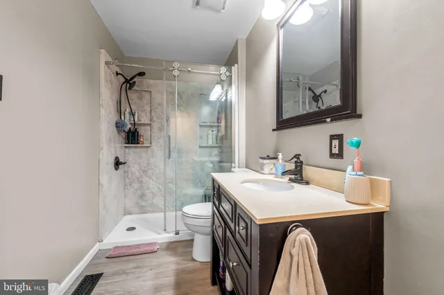 a bedroom with a bed a window and a chandelier