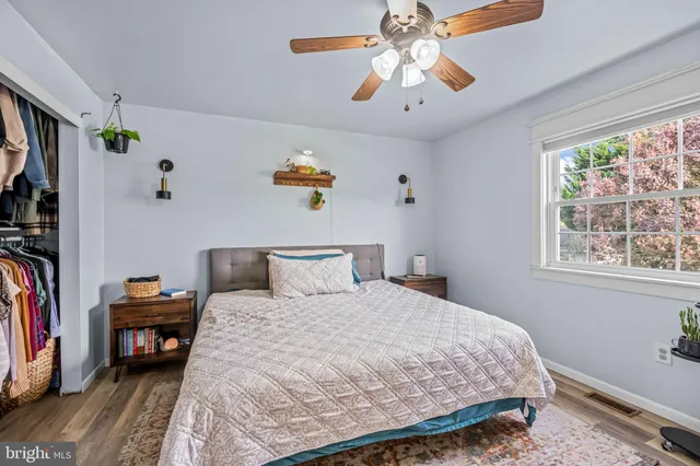 a bedroom with a bed and a tv