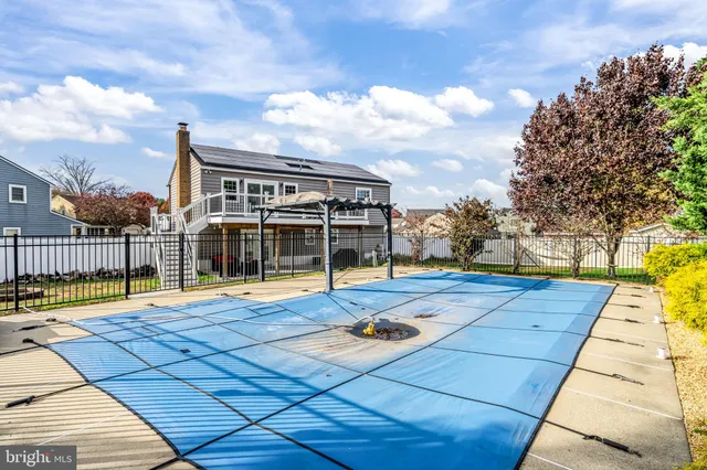 a view of a house with a garden and a yard