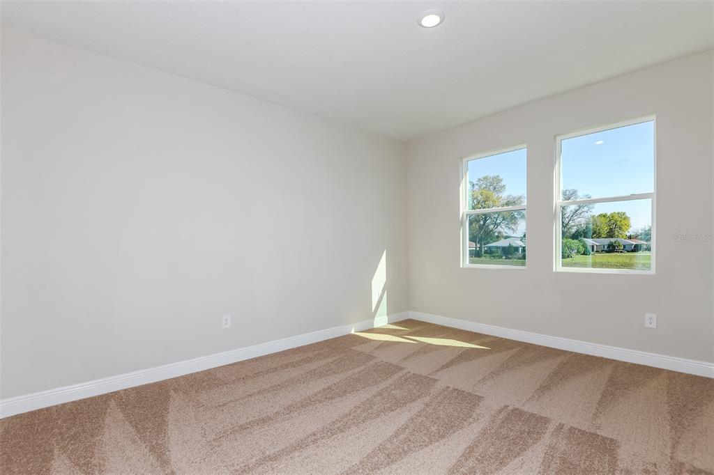 6152 Southwest 97th Street Ocala, FL 34476 - Photo 12 of 31 an empty room with windows