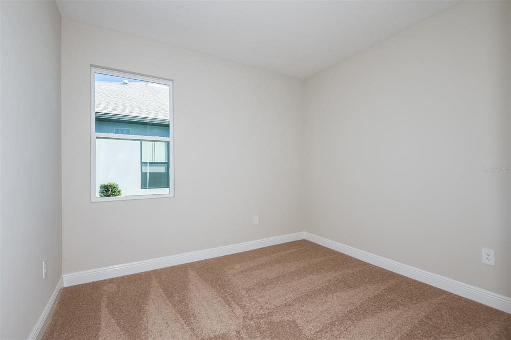 6152 Southwest 97th Street Ocala, FL 34476 - Photo 18 of 31 an empty room with a window
