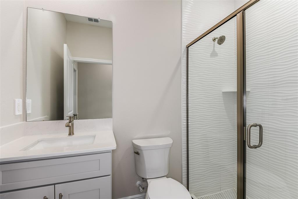 6152 Southwest 97th Street Ocala, FL 34476 - Photo 19 of 31 a bathroom with a sink a toilet and shower