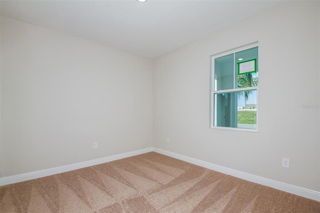 6152 Southwest 97th Street Ocala, FL 34476 - Photo 20 of 31 an empty room with a window