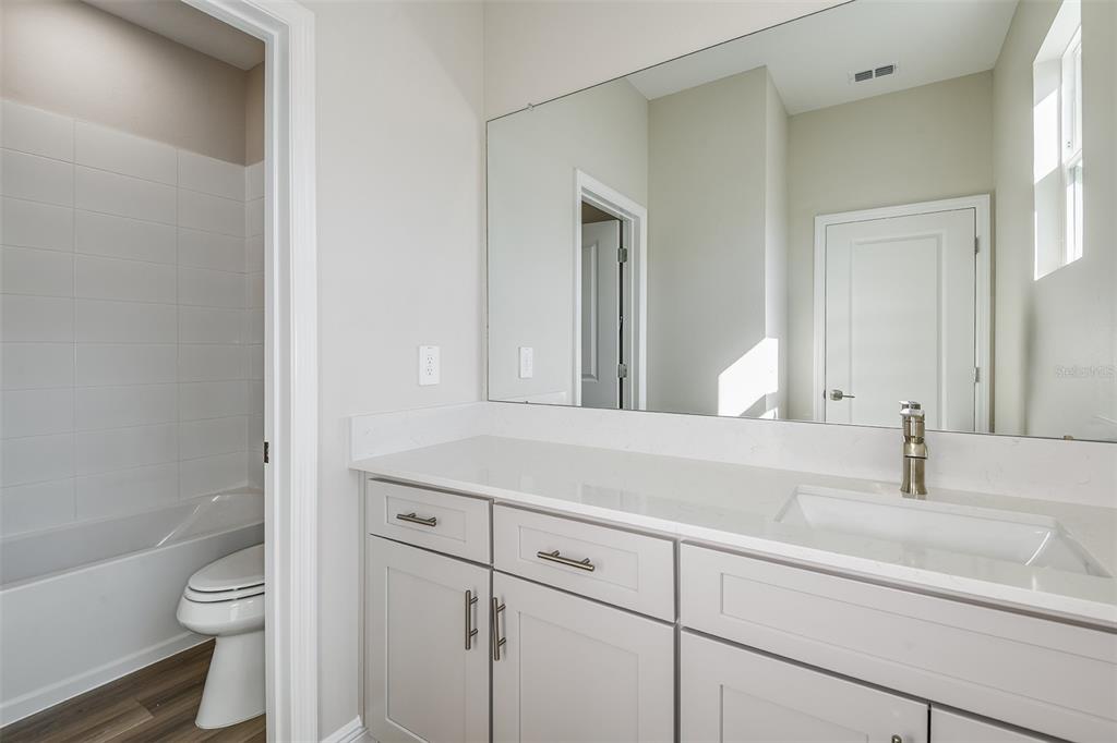 6152 Southwest 97th Street Ocala, FL 34476 - Photo 21 of 31 a bathroom with a sink and a toilet