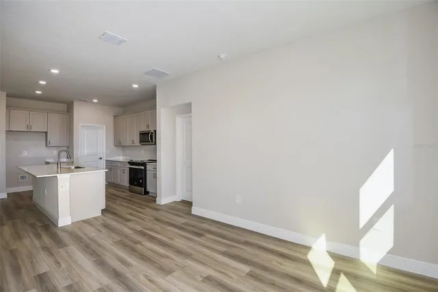a view of kitchen with wooden floor