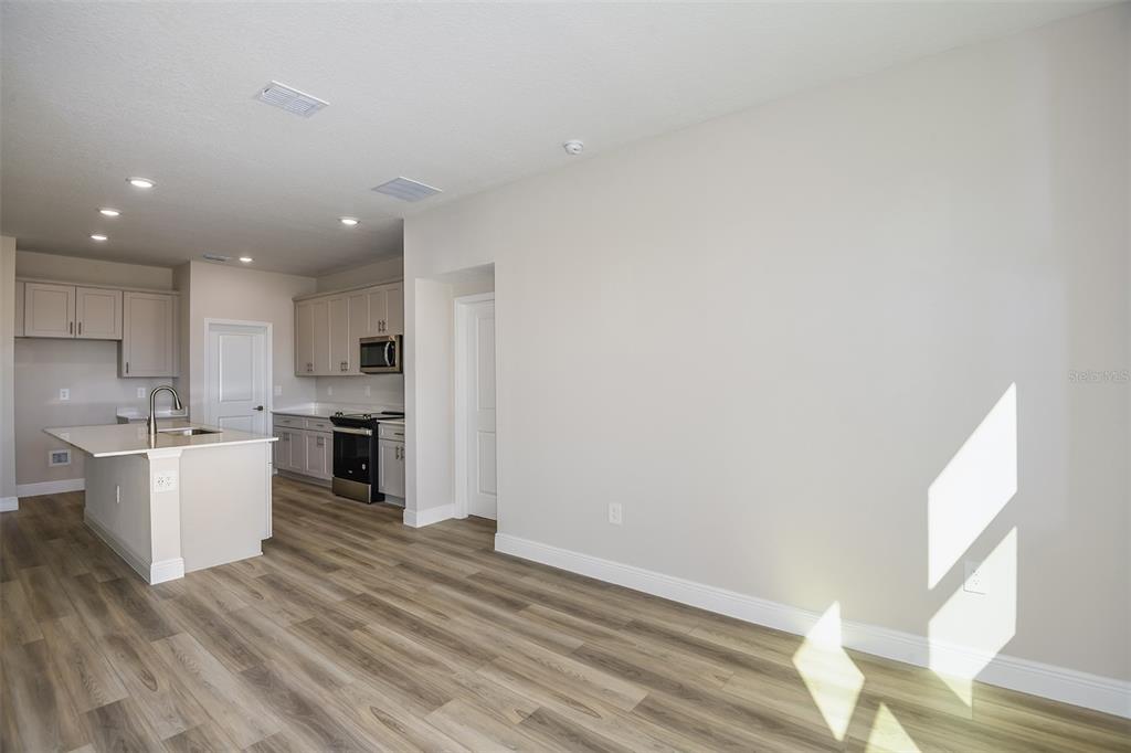 6152 Southwest 97th Street Ocala, FL 34476 - Photo 6 of 31 a view of kitchen with wooden floor