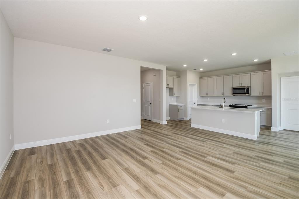 6152 Southwest 97th Street Ocala, FL 34476 - Photo 7 of 31 a view of kitchen with wooden floor