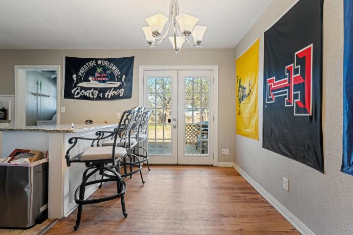 3004 33rd Street Lubbock, TX 79410 - Photo 3 of 10 a view of a dining room with furniture and a chandelier