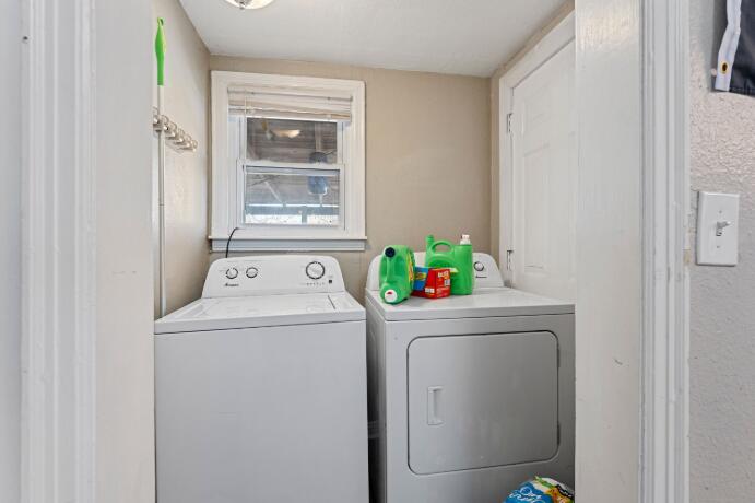 3004 33rd Street Lubbock, TX 79410 - Photo 5 of 10 a utility room with dryer and washer