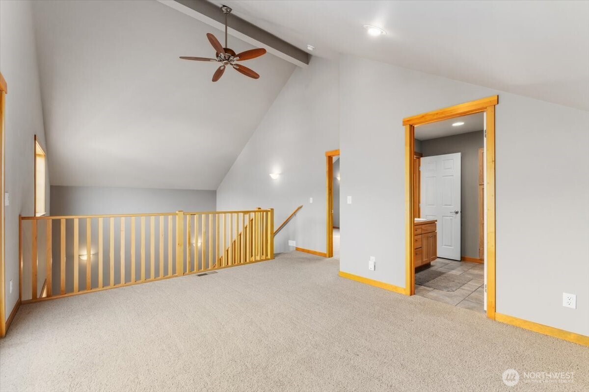 585 Entiat Place Orondo, WA 98843 - Photo 16 of 40 an empty room with a ceiling fan and carpet