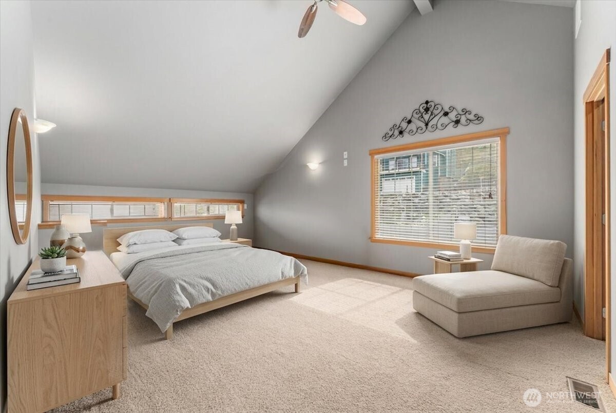 585 Entiat Place Orondo, WA 98843 - Photo 19 of 40 a spacious bedroom with a bed and a couch