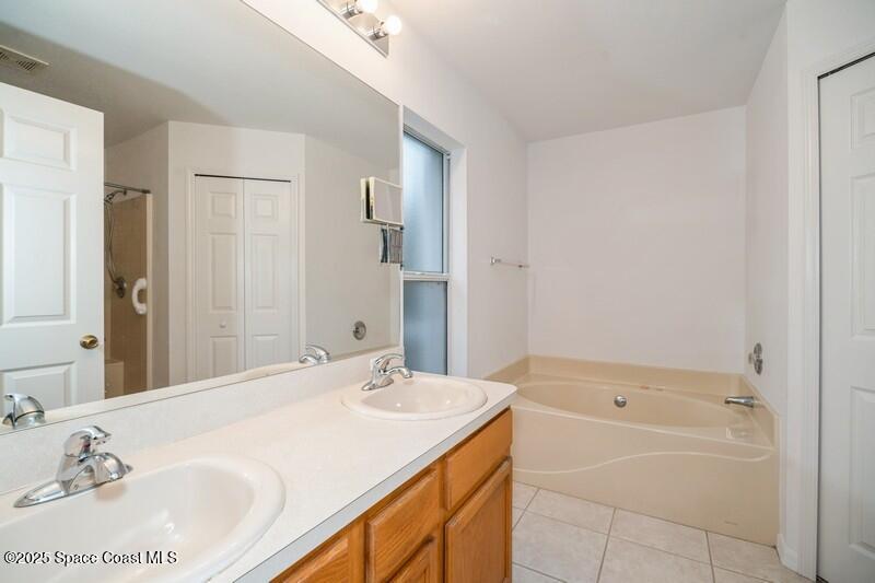 570 Benton Drive Melbourne, FL 32901 - Photo 13 of 26 a bathroom with a sink and a mirror