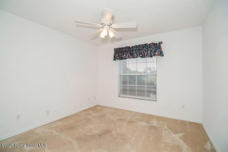 570 Benton Drive Melbourne, FL 32901 - Photo 17 of 26 an empty room with a window