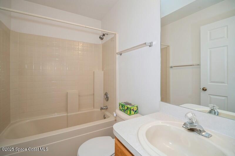 570 Benton Drive Melbourne, FL 32901 - Photo 19 of 26 a bathroom with a sink toilet and shower