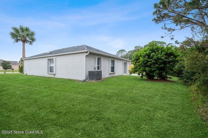 570 Benton Drive Melbourne, FL 32901 - Photo 23 of 26 a view of a house with backyard and garden