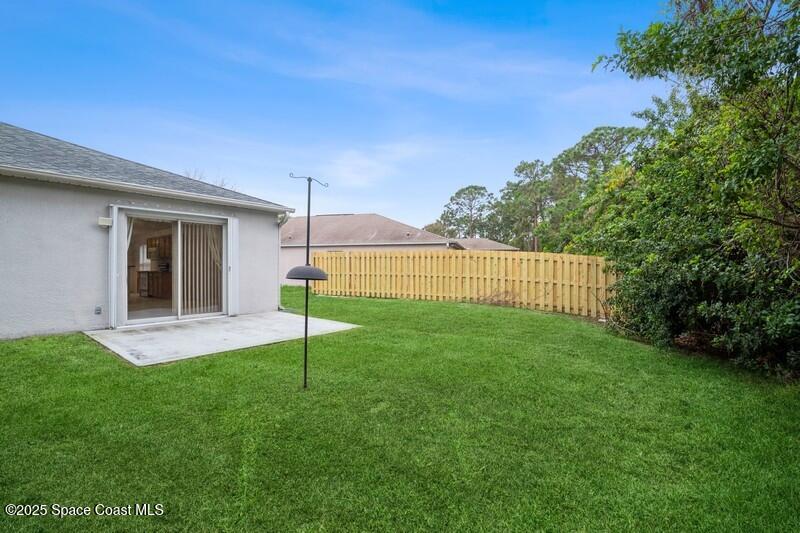 570 Benton Drive Melbourne, FL 32901 - Photo 25 of 26 a view of a house with a backyard