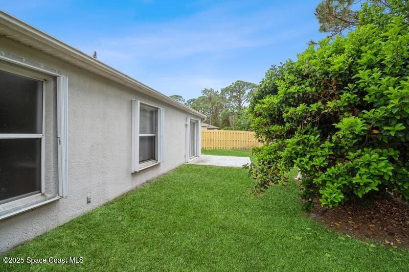 570 Benton Drive Melbourne, FL 32901 - Photo 26 of 26 a front view of house with yard and trees