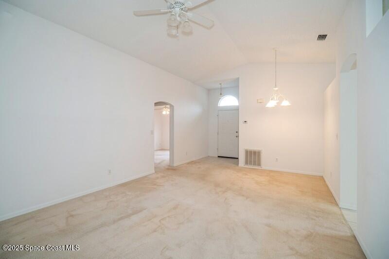 570 Benton Drive Melbourne, FL 32901 - Photo 5 of 26 a view of an empty room with a fan