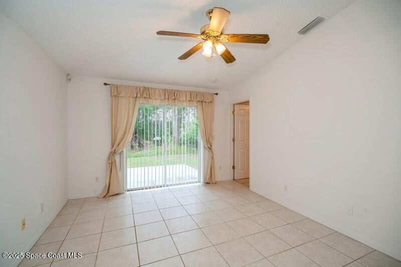 570 Benton Drive Melbourne, FL 32901 - Photo 9 of 26 a view of an empty room with a window