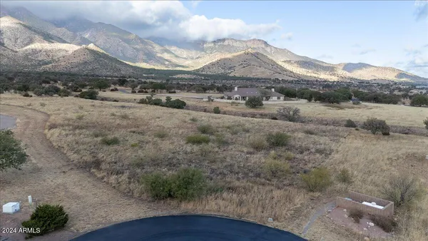 a view of a barn with a mountain