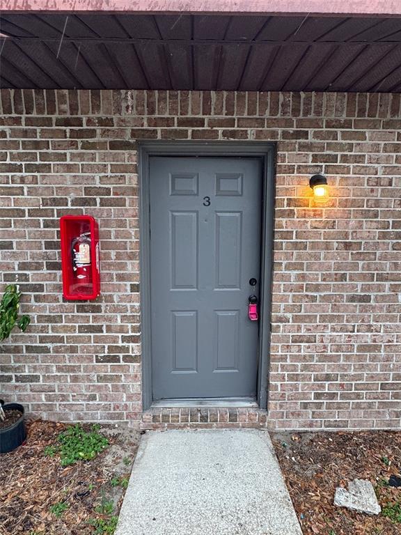 1185 Bentley Road, Unit 3 Leesburg, FL 34748 - Photo 2 of 11 a view of a door with an empty room