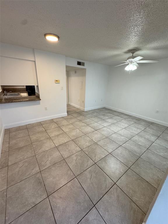 1185 Bentley Road, Unit 3 Leesburg, FL 34748 - Photo 3 of 11 a view of a livingroom with a kitchen