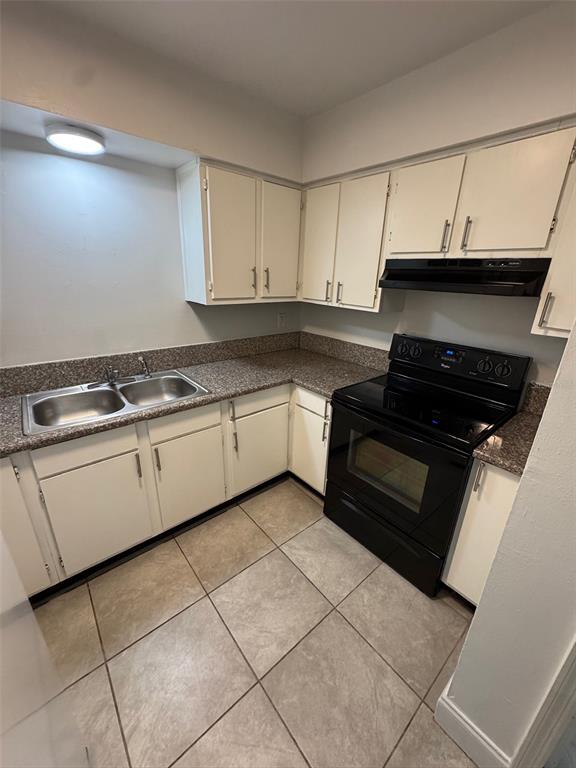 1185 Bentley Road, Unit 3 Leesburg, FL 34748 - Photo 7 of 11 a kitchen with granite countertop a stove sink and cabinets
