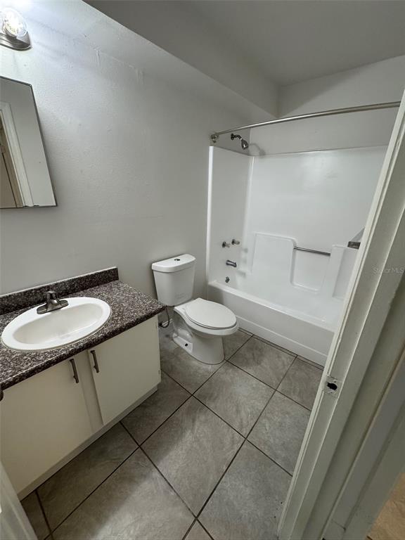 1185 Bentley Road, Unit 3 Leesburg, FL 34748 - Photo 9 of 11 a bathroom with a sink toilet and shower