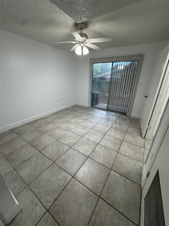 1185 Bentley Road, Unit 3 Leesburg, FL 34748 - Photo 10 of 11 a view of a livingroom with a fan