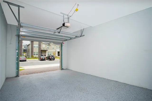 a kitchen with stainless steel appliances granite countertop a sink a stove and a microwave