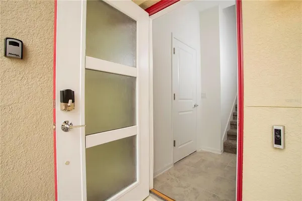 a dining room with furniture and a window