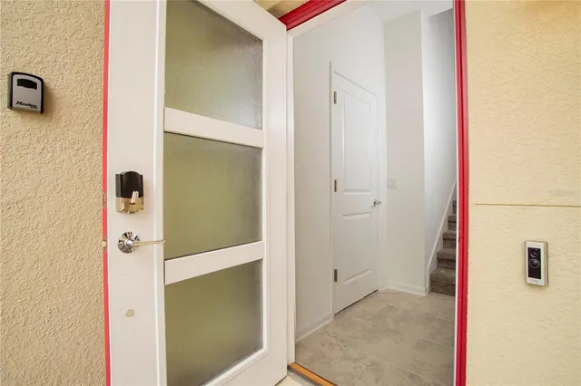 a dining room with furniture and a window