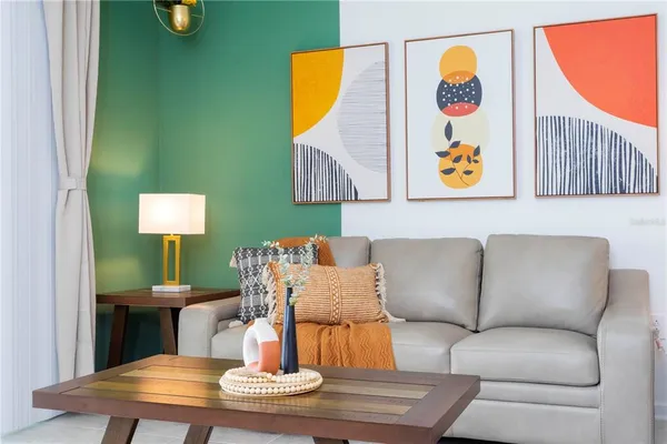 a living room with furniture and a table