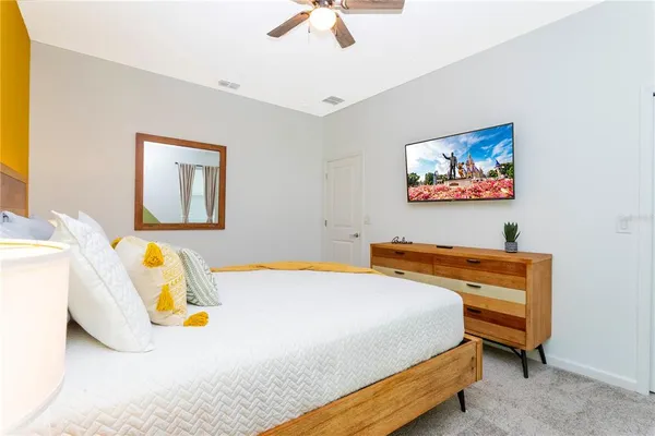 a bedroom with a bed and a window