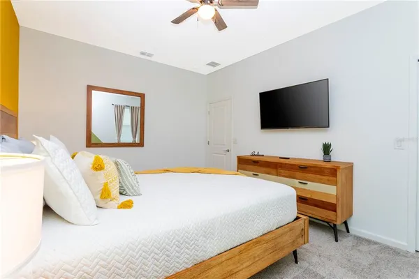 a view of a room with furniture and a window