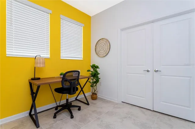 an aerial view of multiple houses with yard