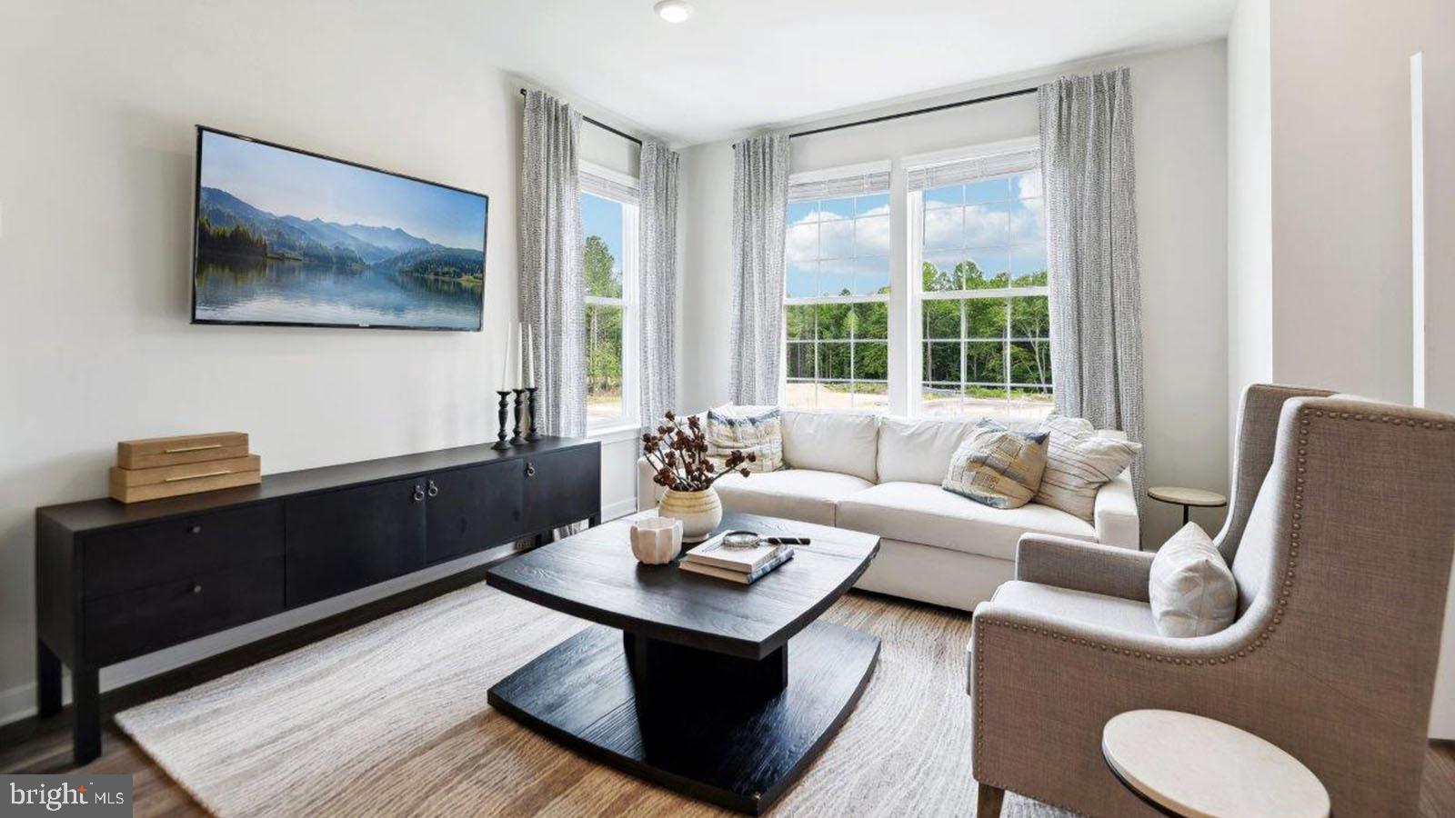 27 Clementon Road East Gibbsboro, NJ 08026 - Photo 18 of 40 a living room with furniture and a flat screen tv