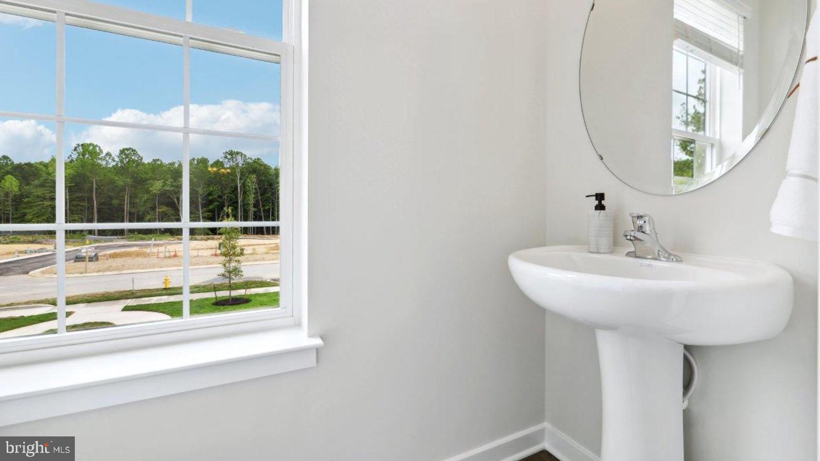 27 Clementon Road East Gibbsboro, NJ 08026 - Photo 23 of 40 a bathroom with a sink and a mirror