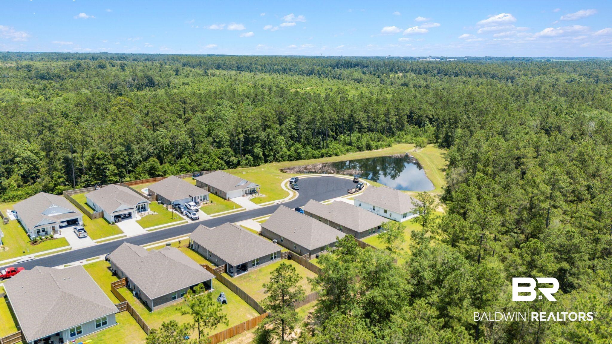 13966 Antler Hl Road Daphne, AL 36527 - Photo 40 of 44 Aerial view of a residential development with multiple single-story homes featuring light-colored roofs