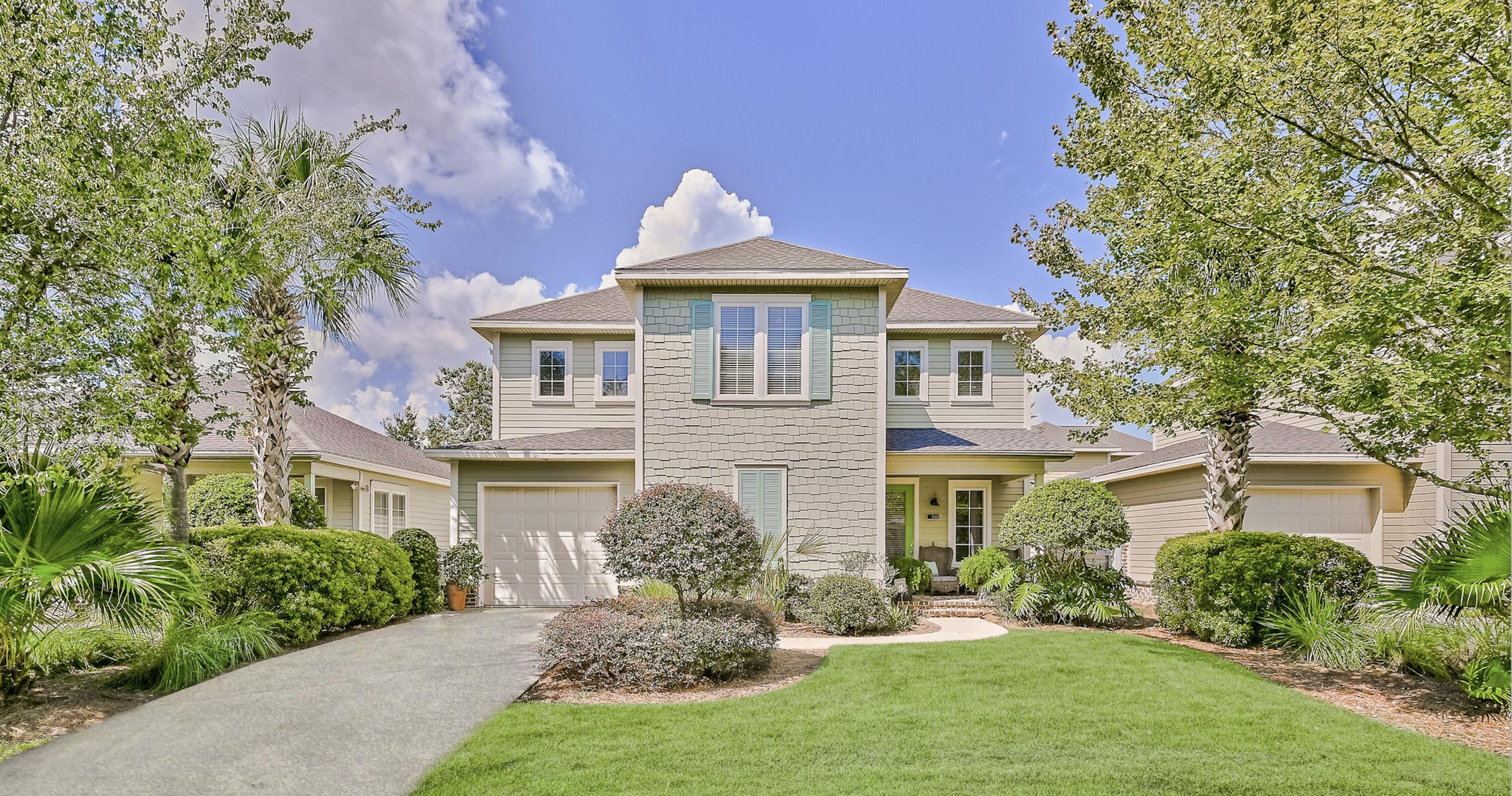 100 South Zander Way Santa Rosa Beach, FL 32459 - Photo 1 of 40 a front view of a house with garden