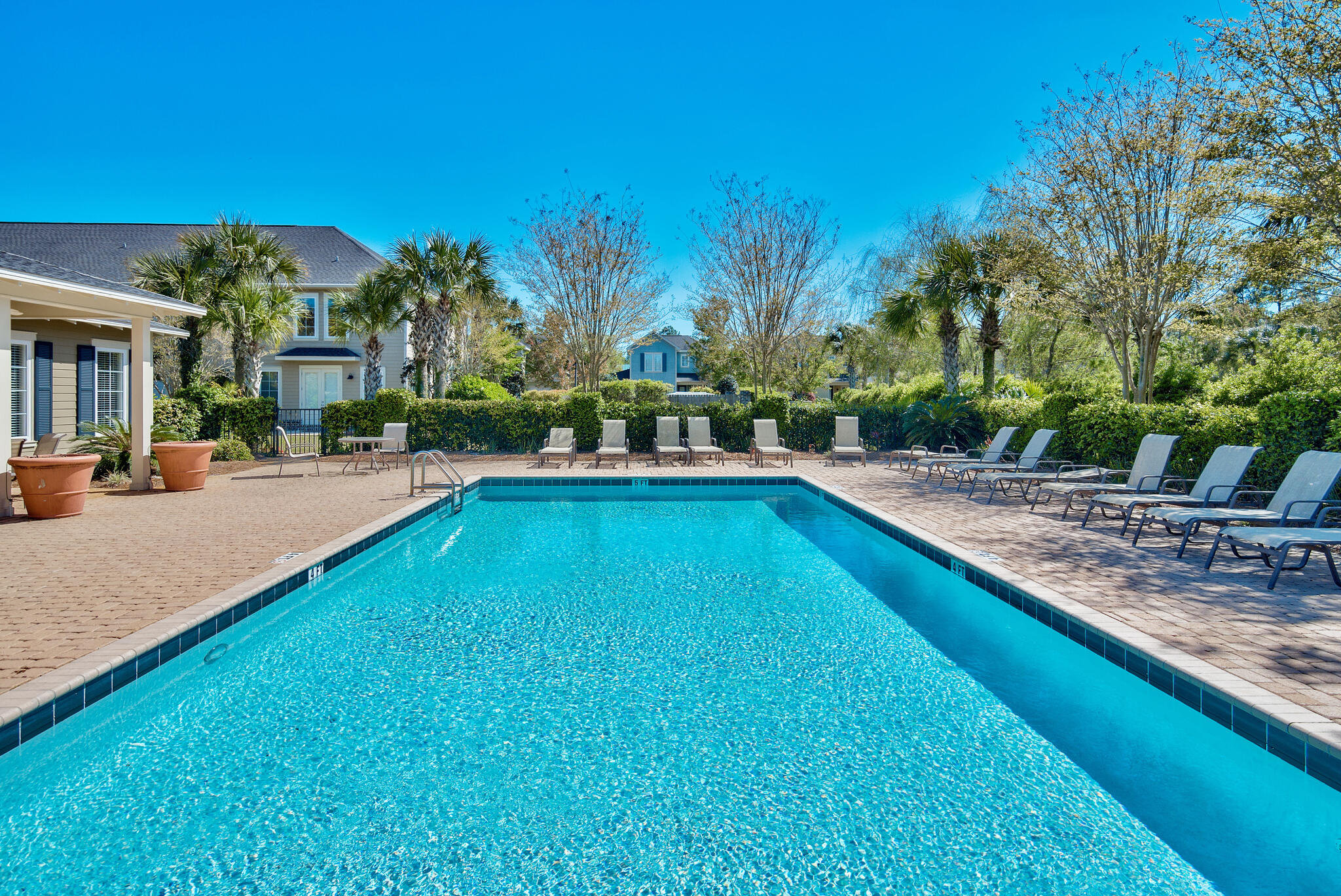 100 South Zander Way Santa Rosa Beach, FL 32459 - Photo 33 of 40 a view of swimming pool with outdoor seating and trees in the background